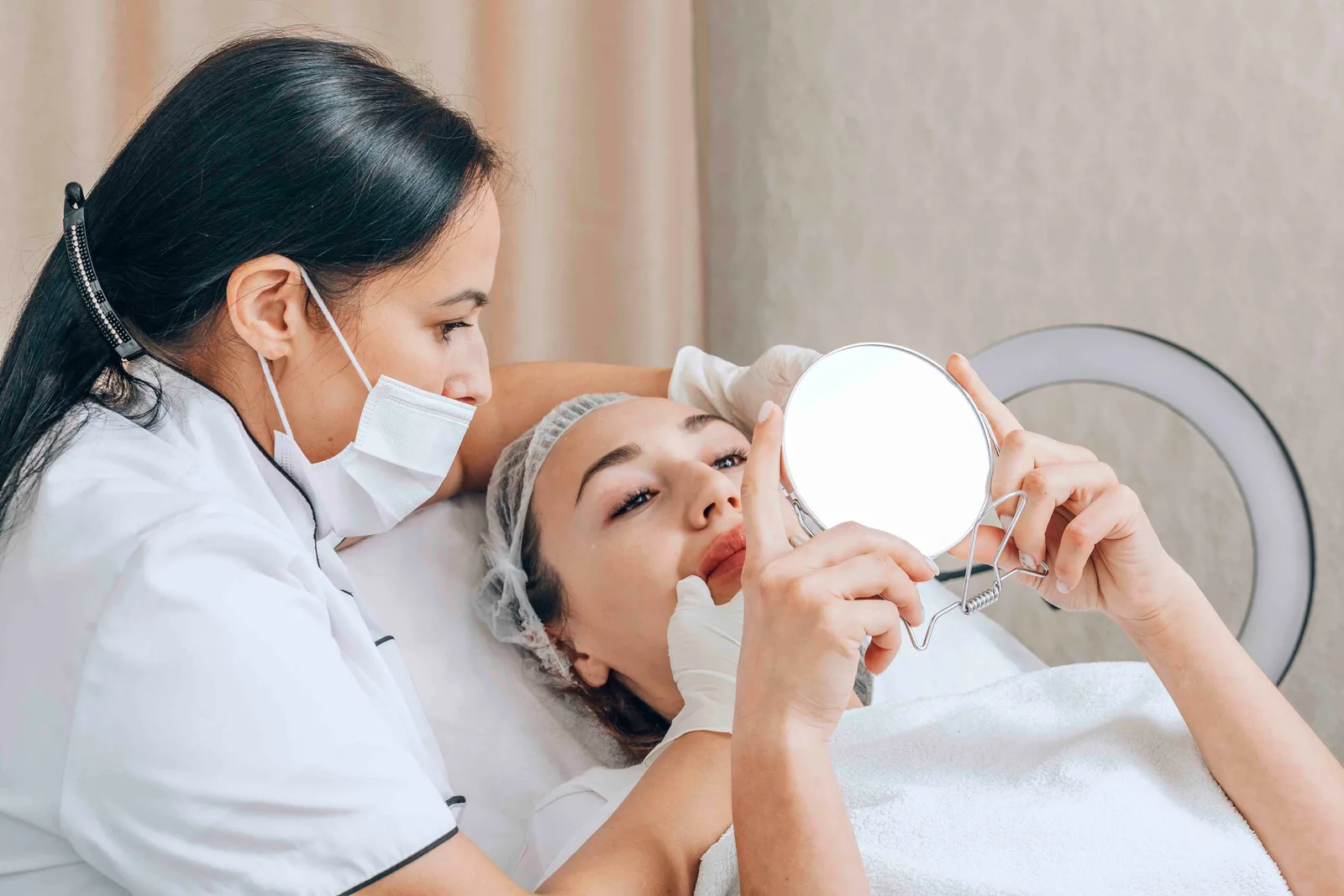 Dermatology clinician discussing treatment with a patient
