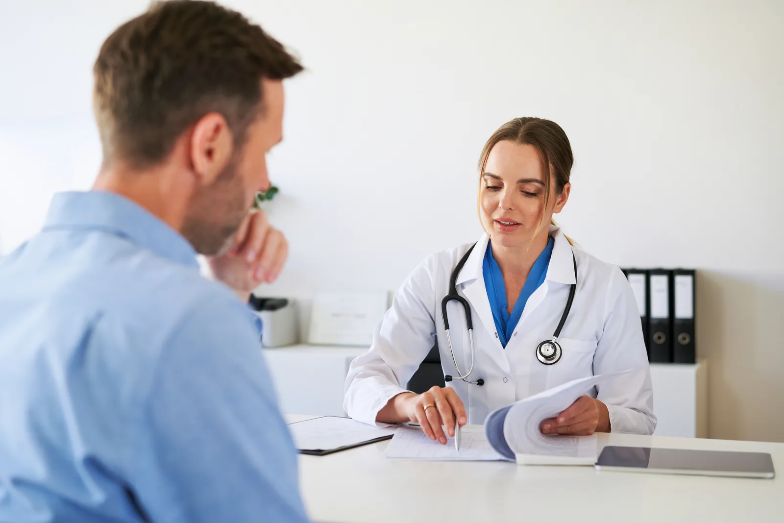 Physician consulting with a patient in a clinic